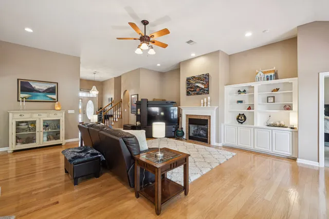a living room with furniture and fireplace