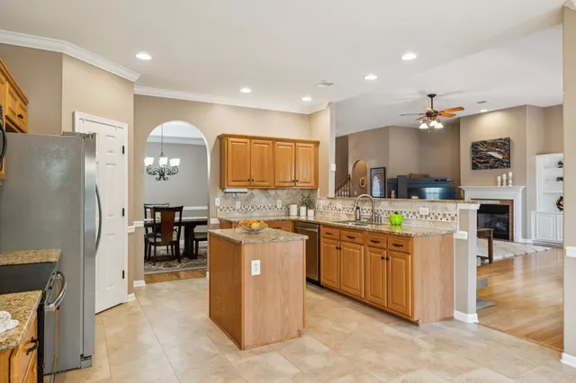 a kitchen with cabinets a sink and appliances