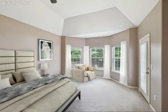 a bedroom with a bed and glass window