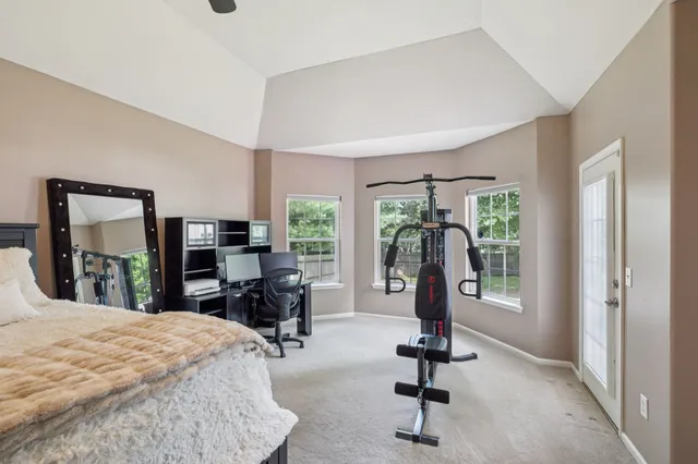 a view of a livingroom with furniture and a window
