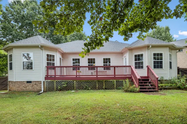 a front view of a house with a garden and porch
