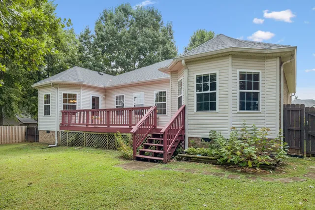 a front view of a house with a garden and porch