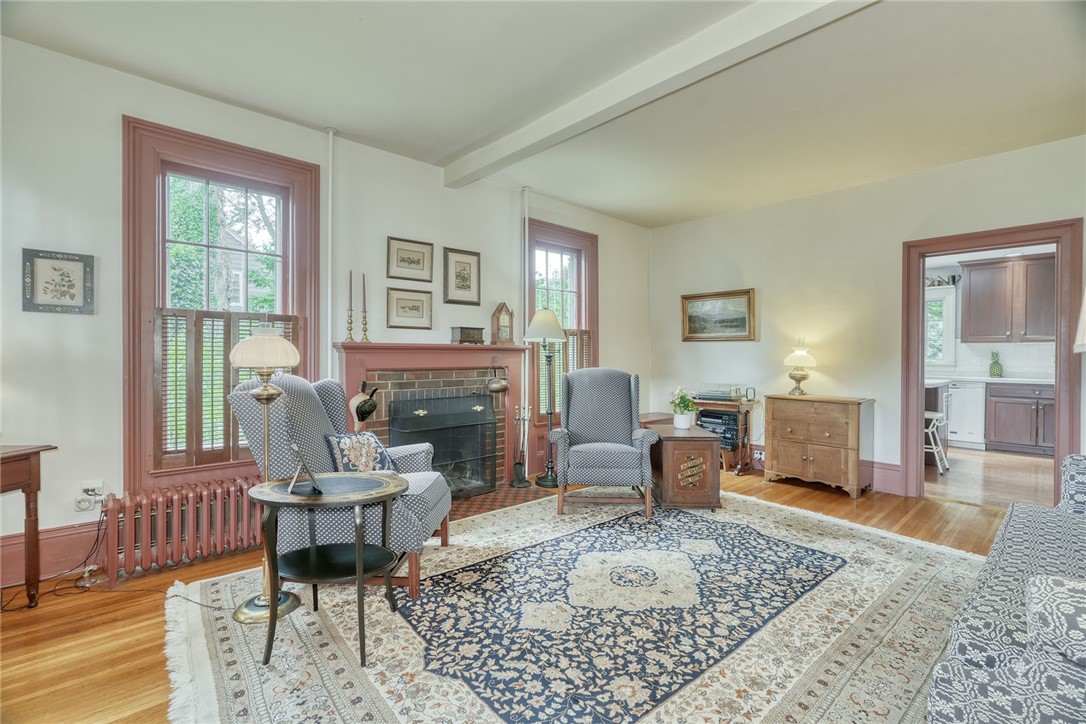 1479 Creek Street Rochester, NY 14625 - Photo 15 of 50 FORMAL LIVING ROOM * HARDWOODS *WOODBURNING FIREPL