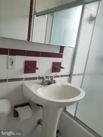 a bathroom with a sink and mirror
