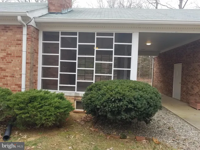 a view of front door and yard