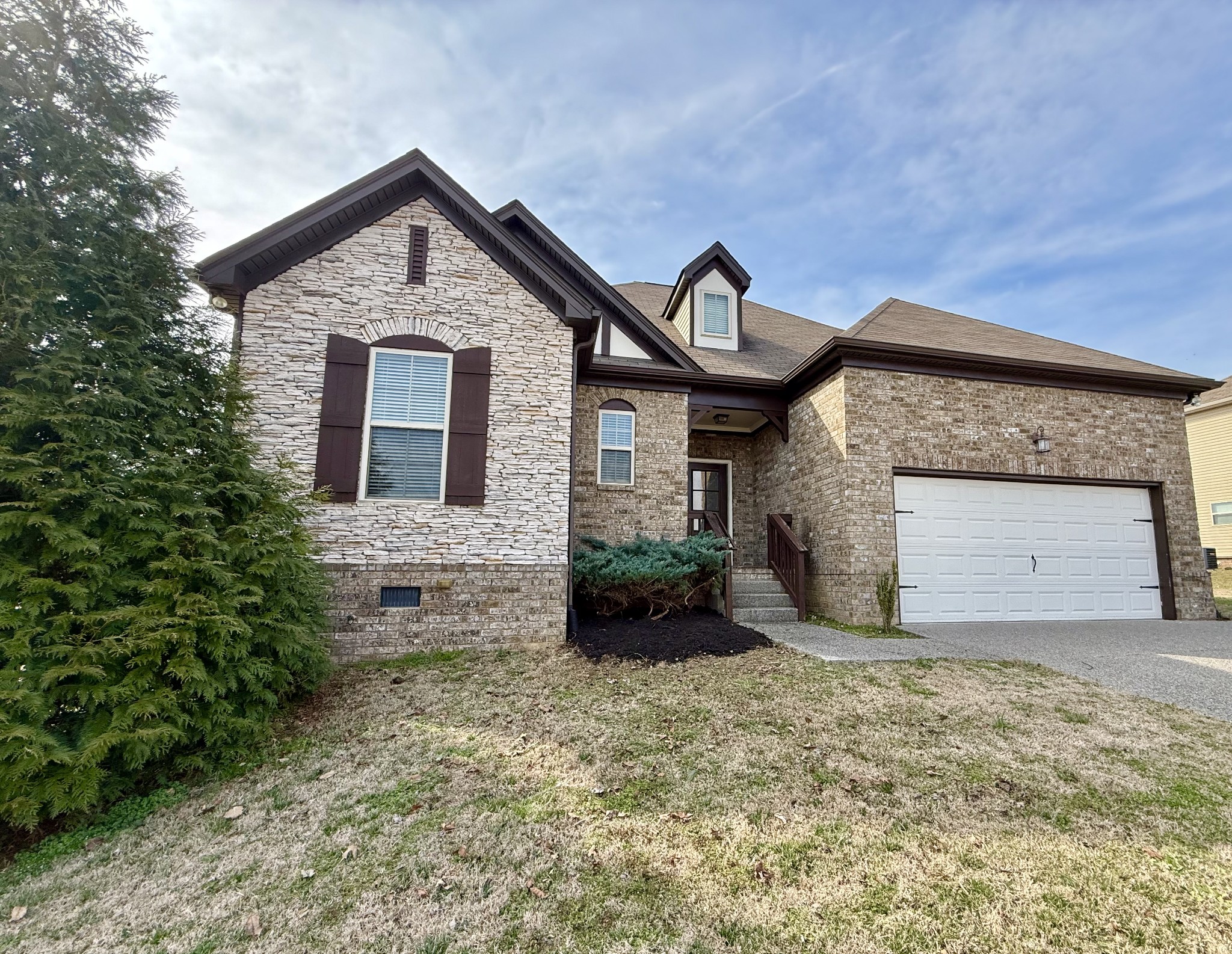 4012 Lexie Lane Spring Hill, TN 37174 - Photo 2 of 38 a front view of a house with a yard