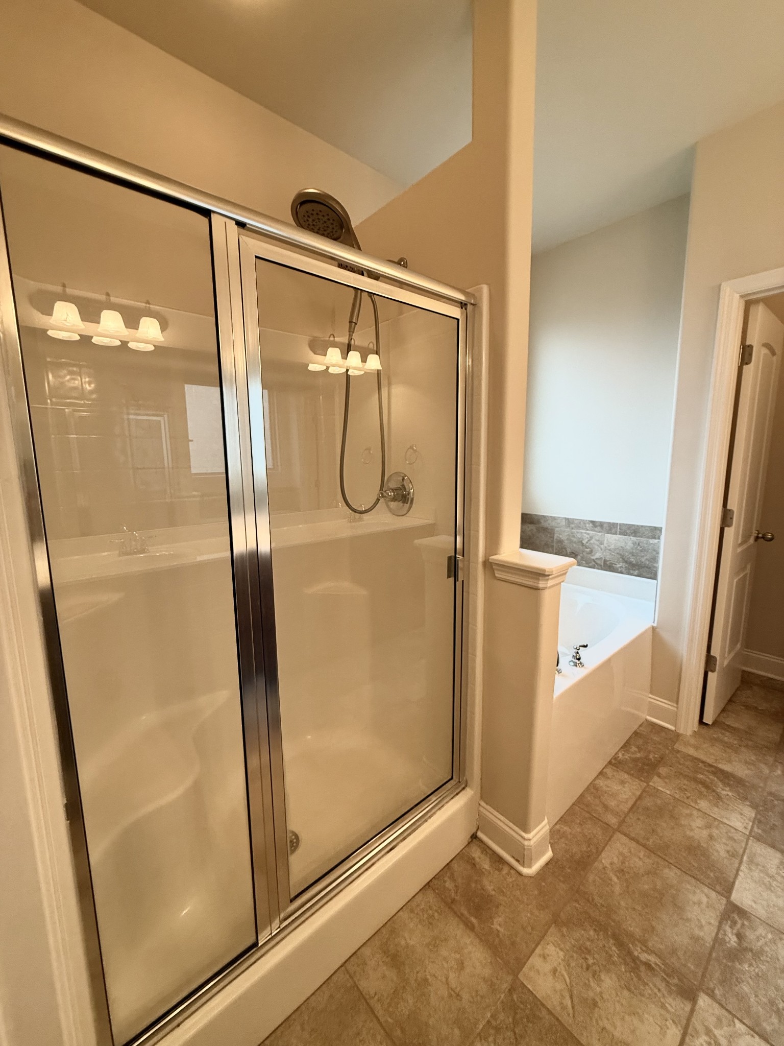 4012 Lexie Lane Spring Hill, TN 37174 - Photo 25 of 38 a bathroom with a glass shower door and mirror