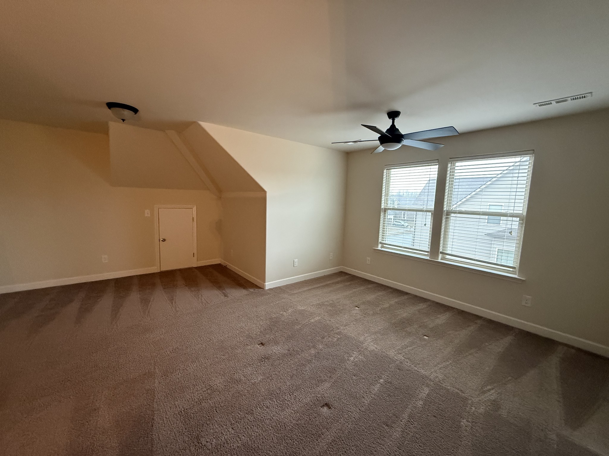 4012 Lexie Lane Spring Hill, TN 37174 - Photo 27 of 38 an empty room with windows and ceiling fan