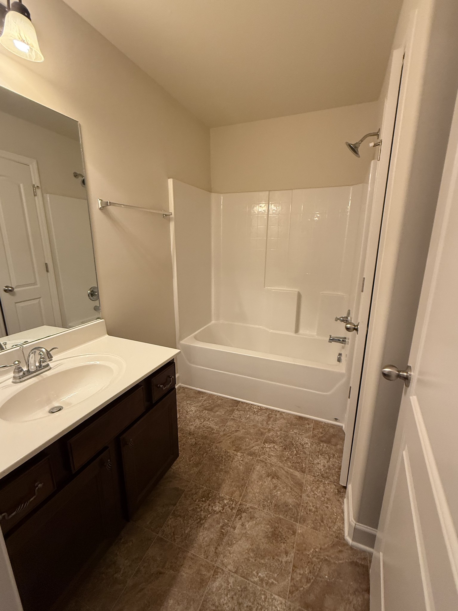 4012 Lexie Lane Spring Hill, TN 37174 - Photo 34 of 38 a bathroom with a bathtub sink and mirror