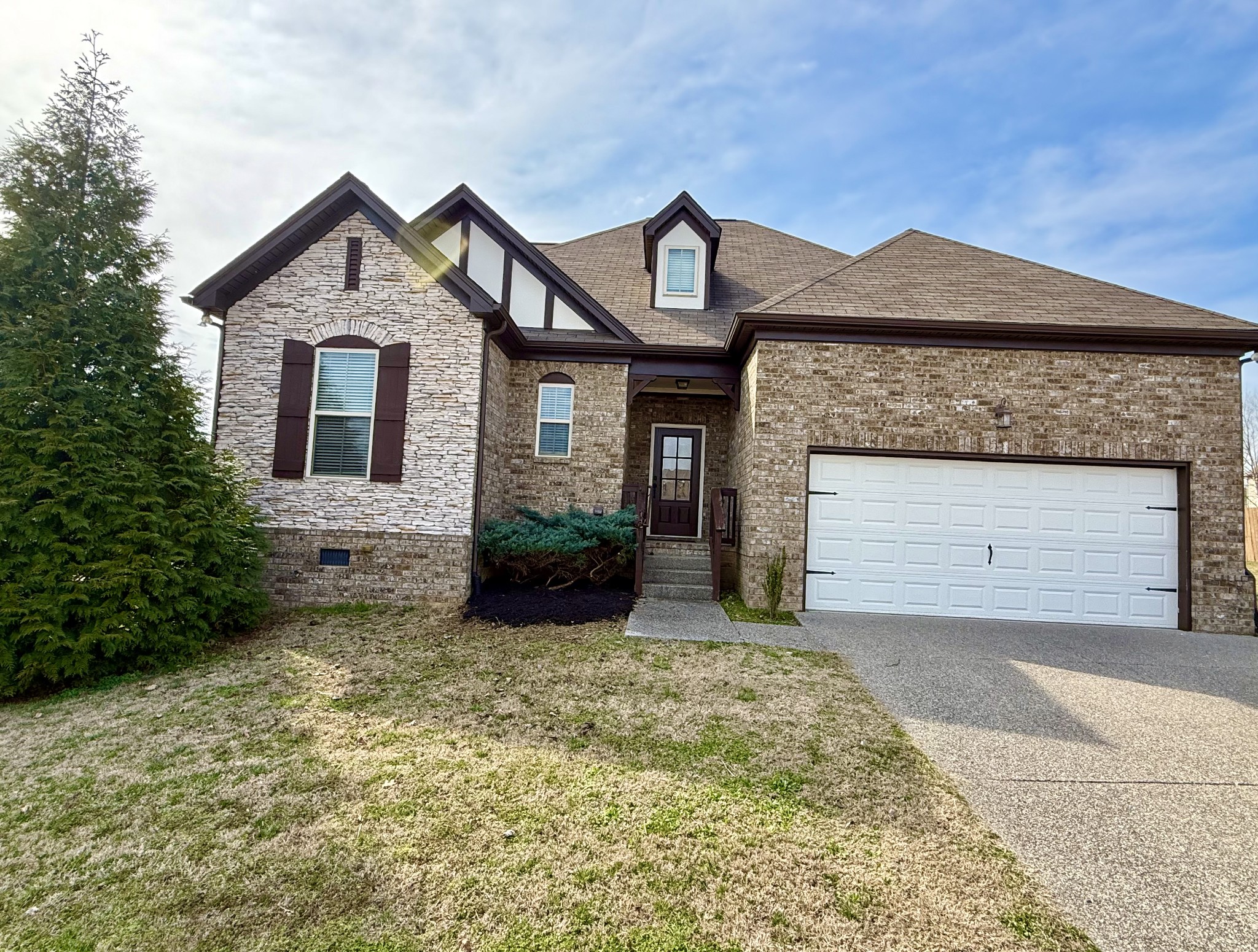 4012 Lexie Lane Spring Hill, TN 37174 - Photo 37 of 38 a front view of a house with a yard and garage