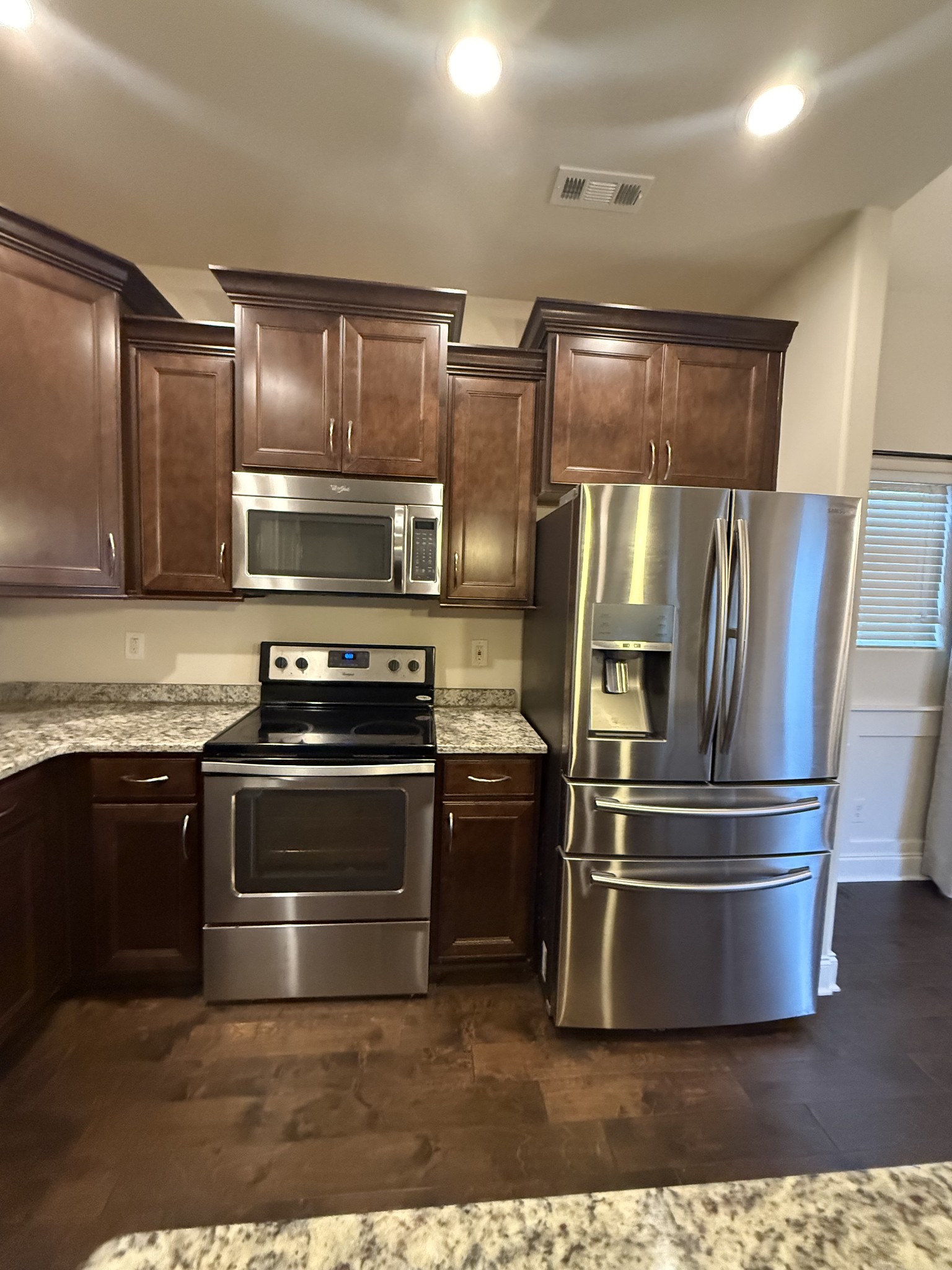 4012 Lexie Lane Spring Hill, TN 37174 - Photo 4 of 38 a metallic refrigerator freezer sitting inside of a kitchen