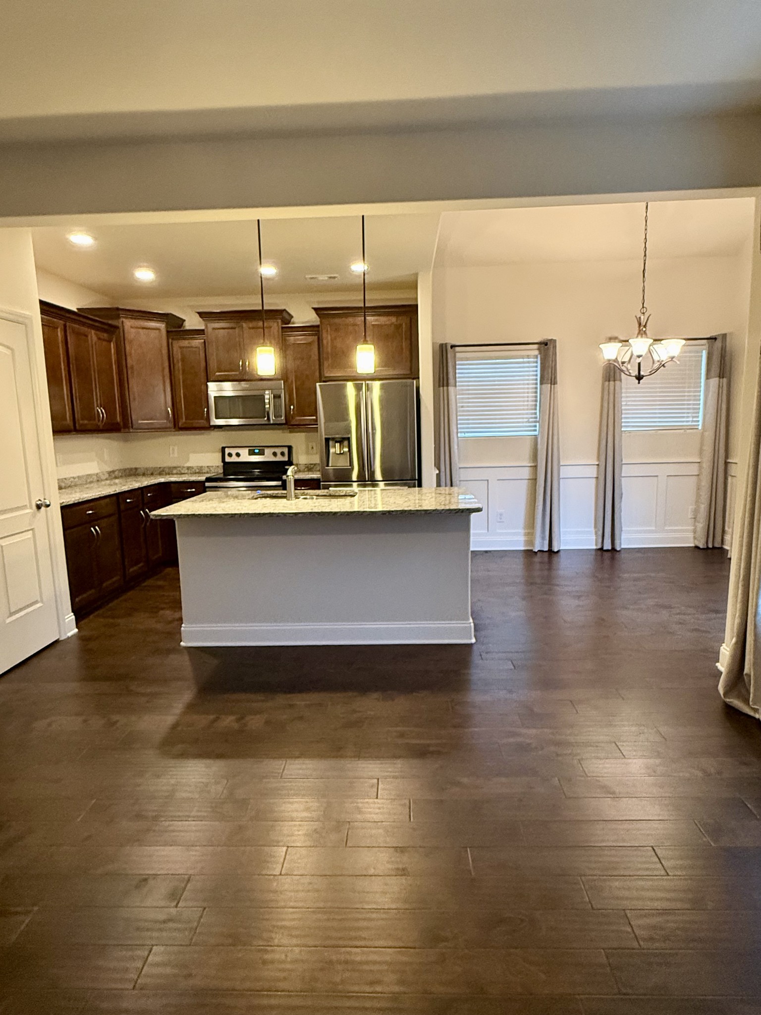 4012 Lexie Lane Spring Hill, TN 37174 - Photo 6 of 38 a large white kitchen with wooden floor