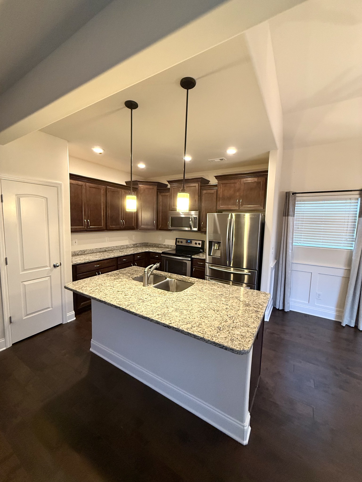 4012 Lexie Lane Spring Hill, TN 37174 - Photo 10 of 38 a large kitchen with stainless steel appliances kitchen island a large island in the center