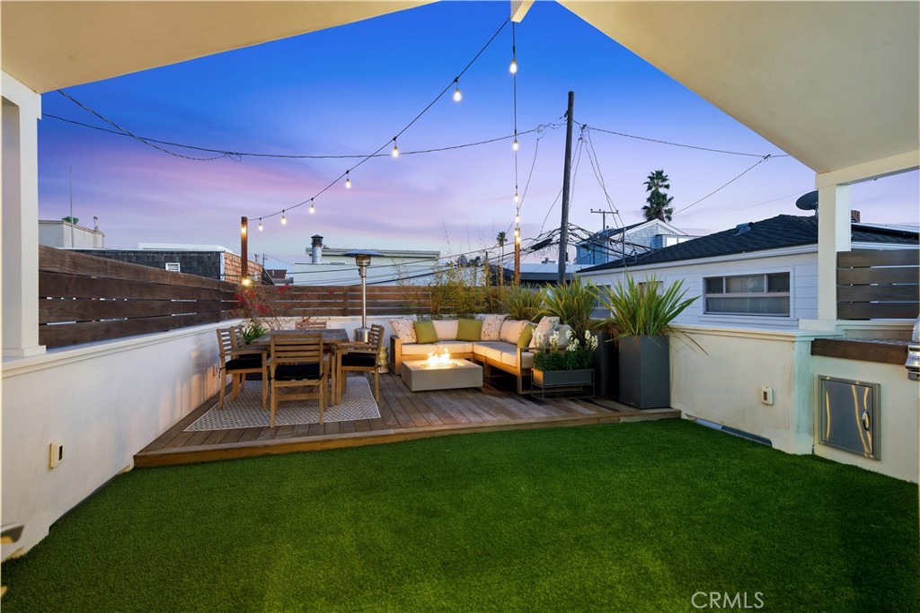 32 56th Place Long Beach, CA 90803 - Photo 18 of 49 a view of a porch with furniture and yard