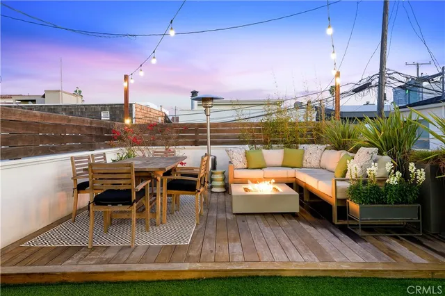a view of a chairs and table in patio with a lake view