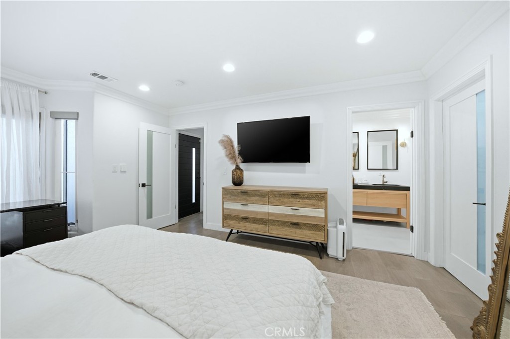 32 56th Place Long Beach, CA 90803 - Photo 27 of 49 a bedroom with furniture and a flat screen tv