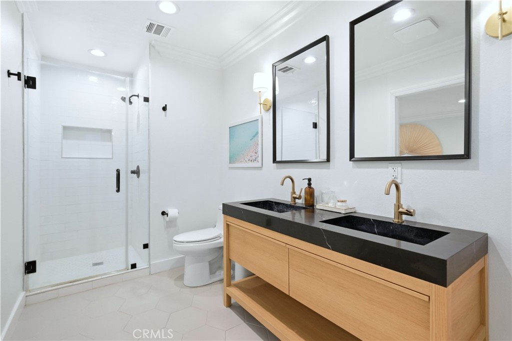 32 56th Place Long Beach, CA 90803 - Photo 30 of 49 a bathroom with a sink a toilet and shower