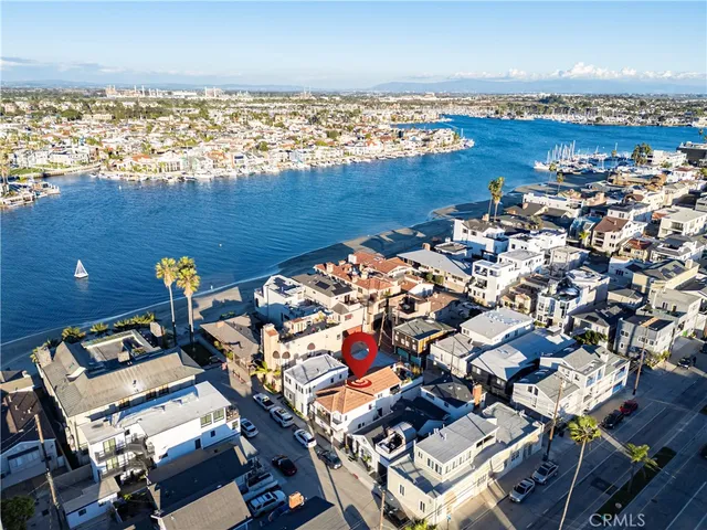 an aerial view of a city with ocean view