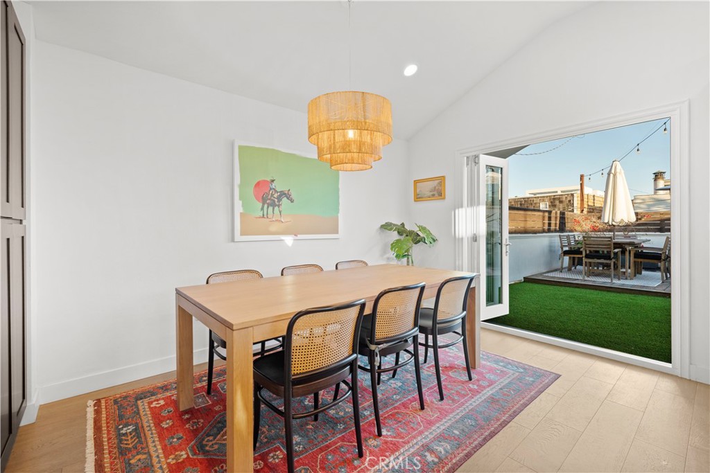 32 56th Place Long Beach, CA 90803 - Photo 9 of 49 a view of a dining room with furniture and wooden floor