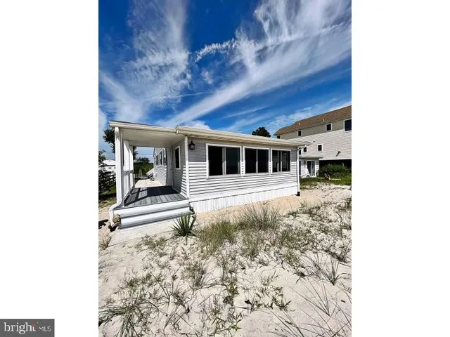 a view of a house with a door and wooden floor