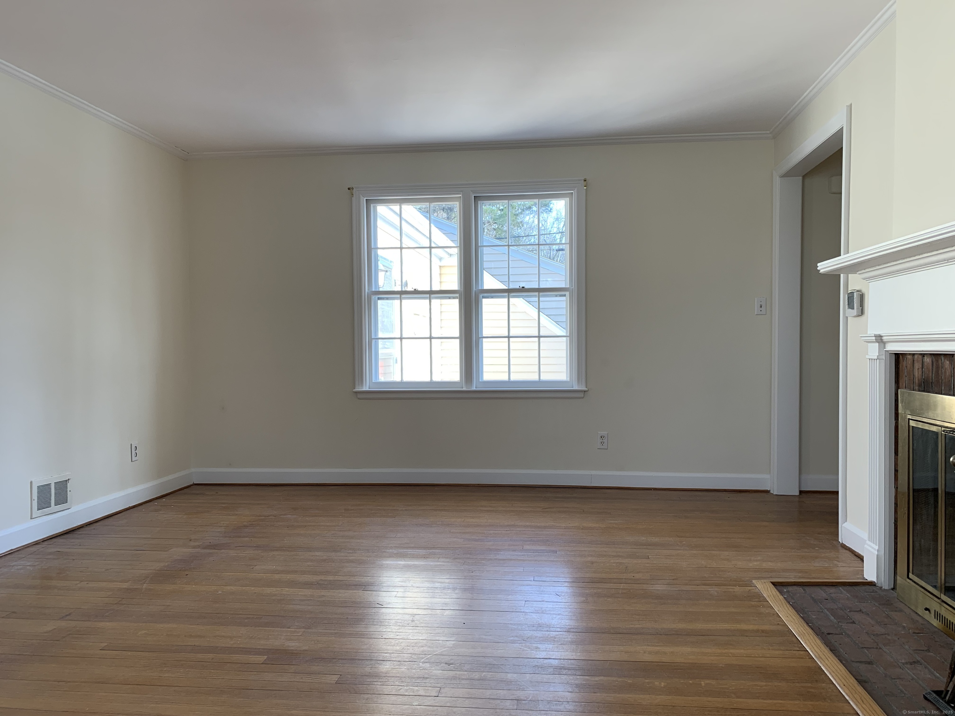 16 Garfield Avenue North Haven, CT 06473 - Photo 14 of 26 a view of an empty room with wooden floor and a window