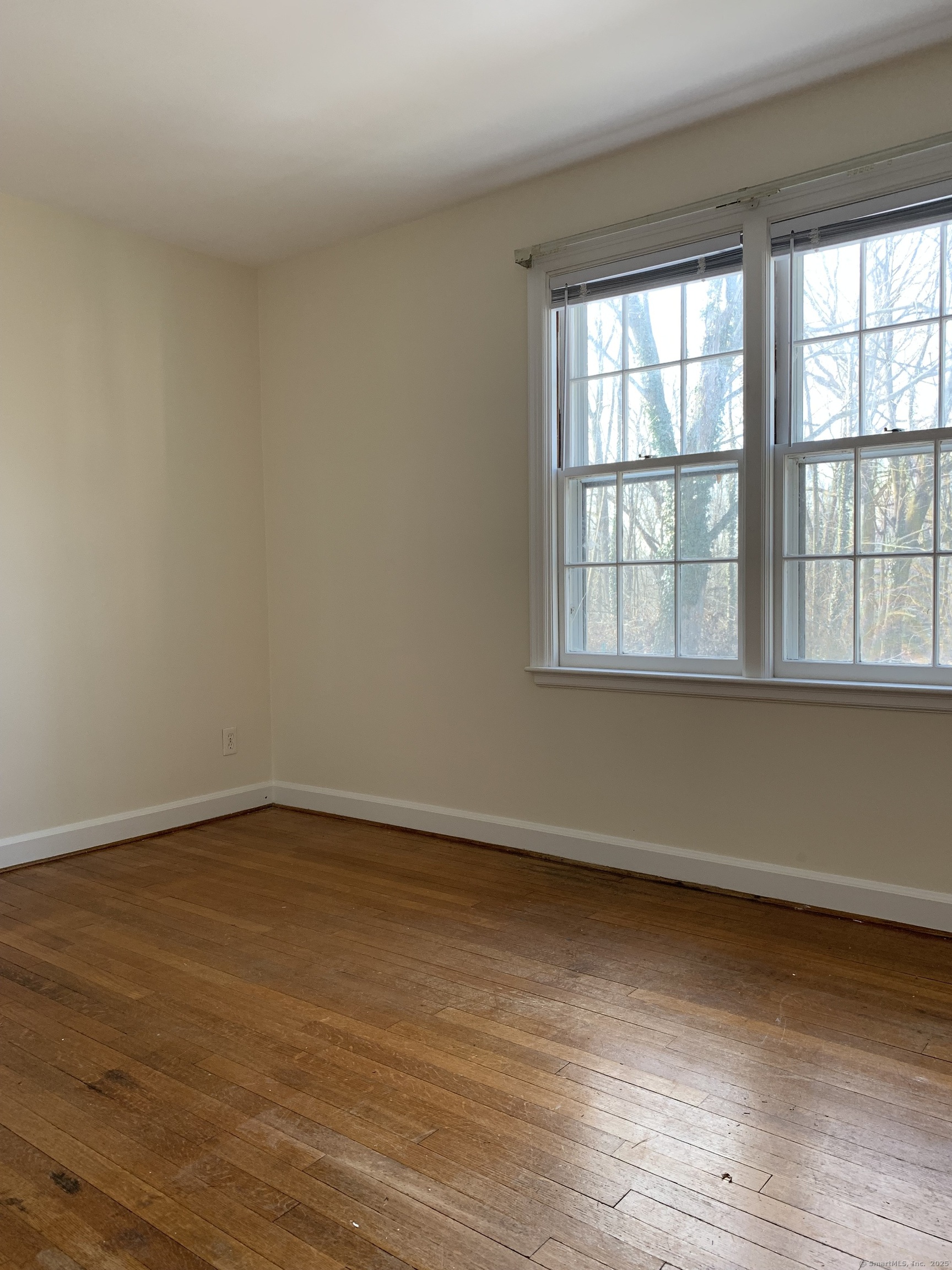 16 Garfield Avenue North Haven, CT 06473 - Photo 17 of 26 an empty room with wooden floor and windows