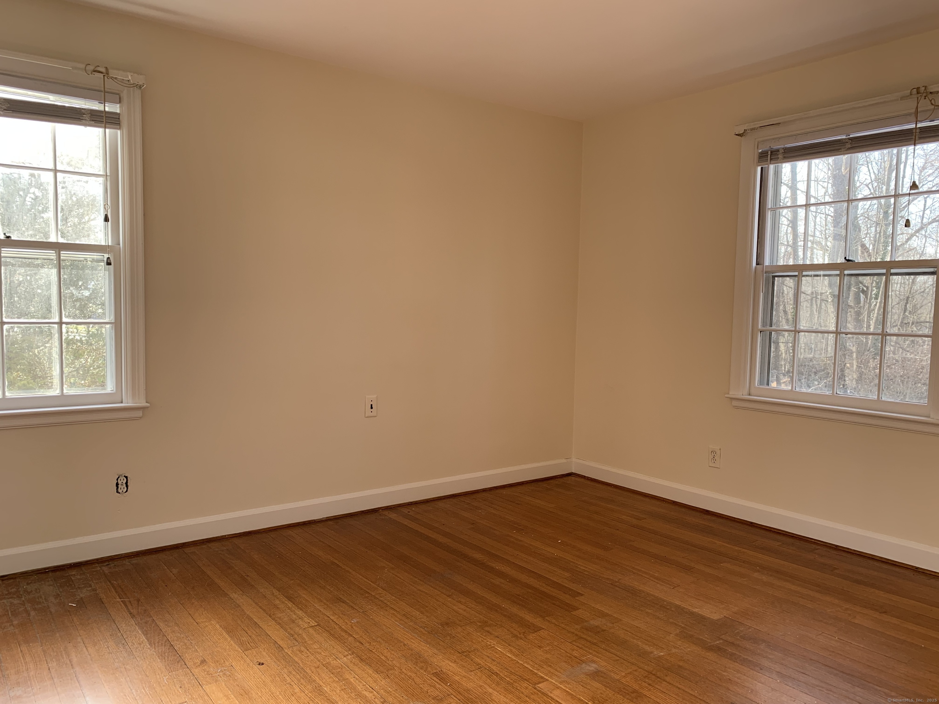 16 Garfield Avenue North Haven, CT 06473 - Photo 19 of 26 an empty room with wooden floor and windows