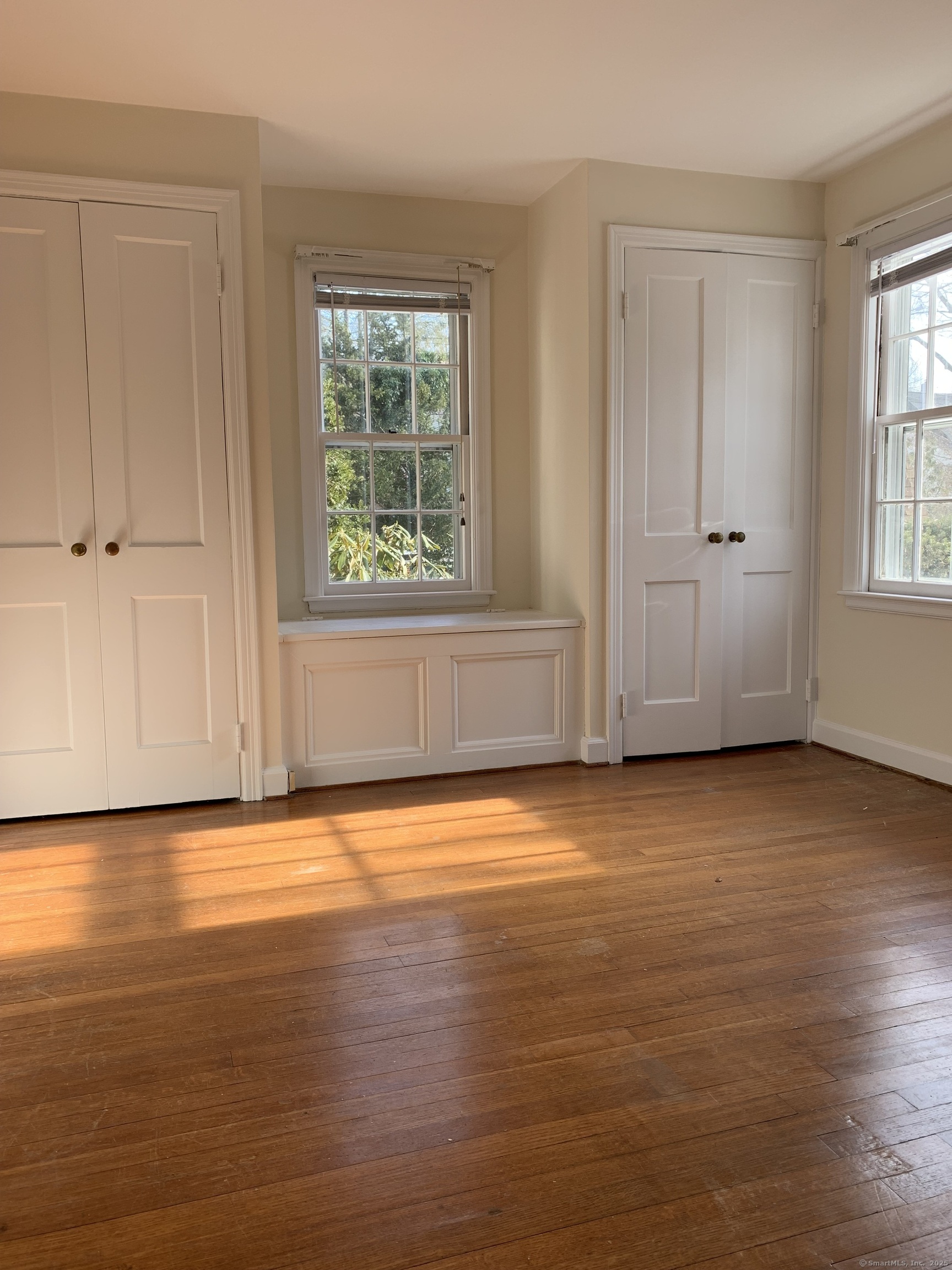 16 Garfield Avenue North Haven, CT 06473 - Photo 22 of 26 an empty room with wooden floor and windows