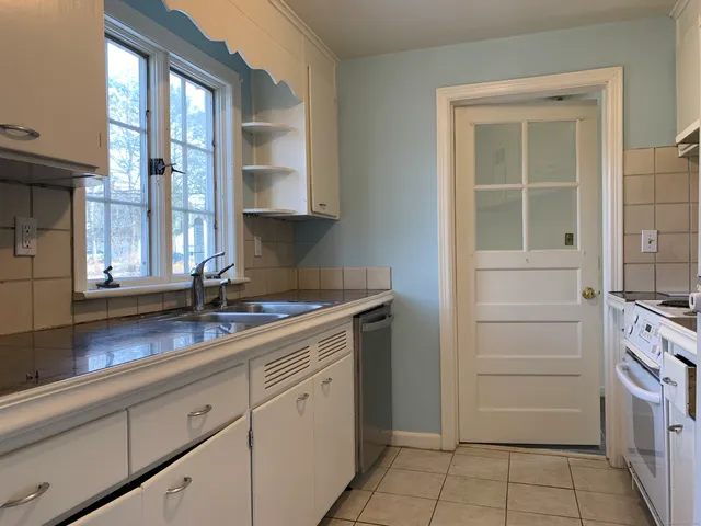 a kitchen with a sink and cabinets