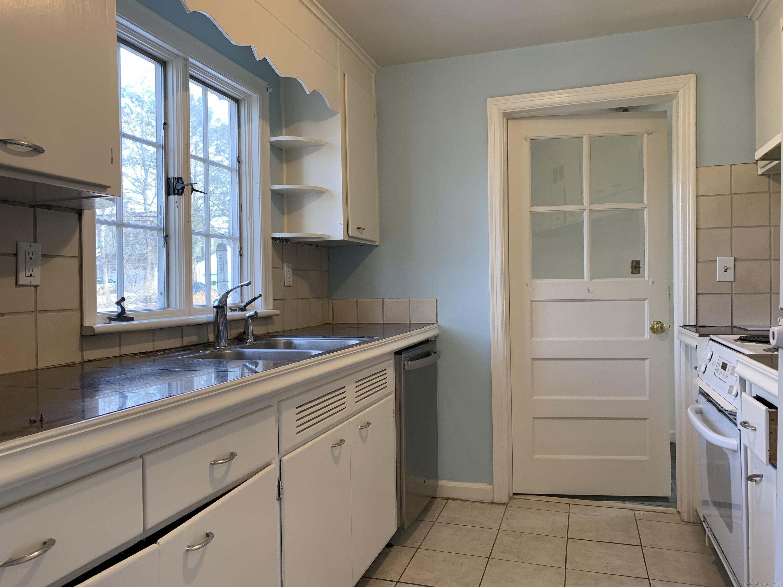 16 Garfield Avenue North Haven, CT 06473 - Photo 5 of 26 a kitchen with a sink and cabinets