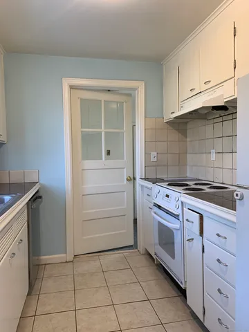 a kitchen with a stove and a sink