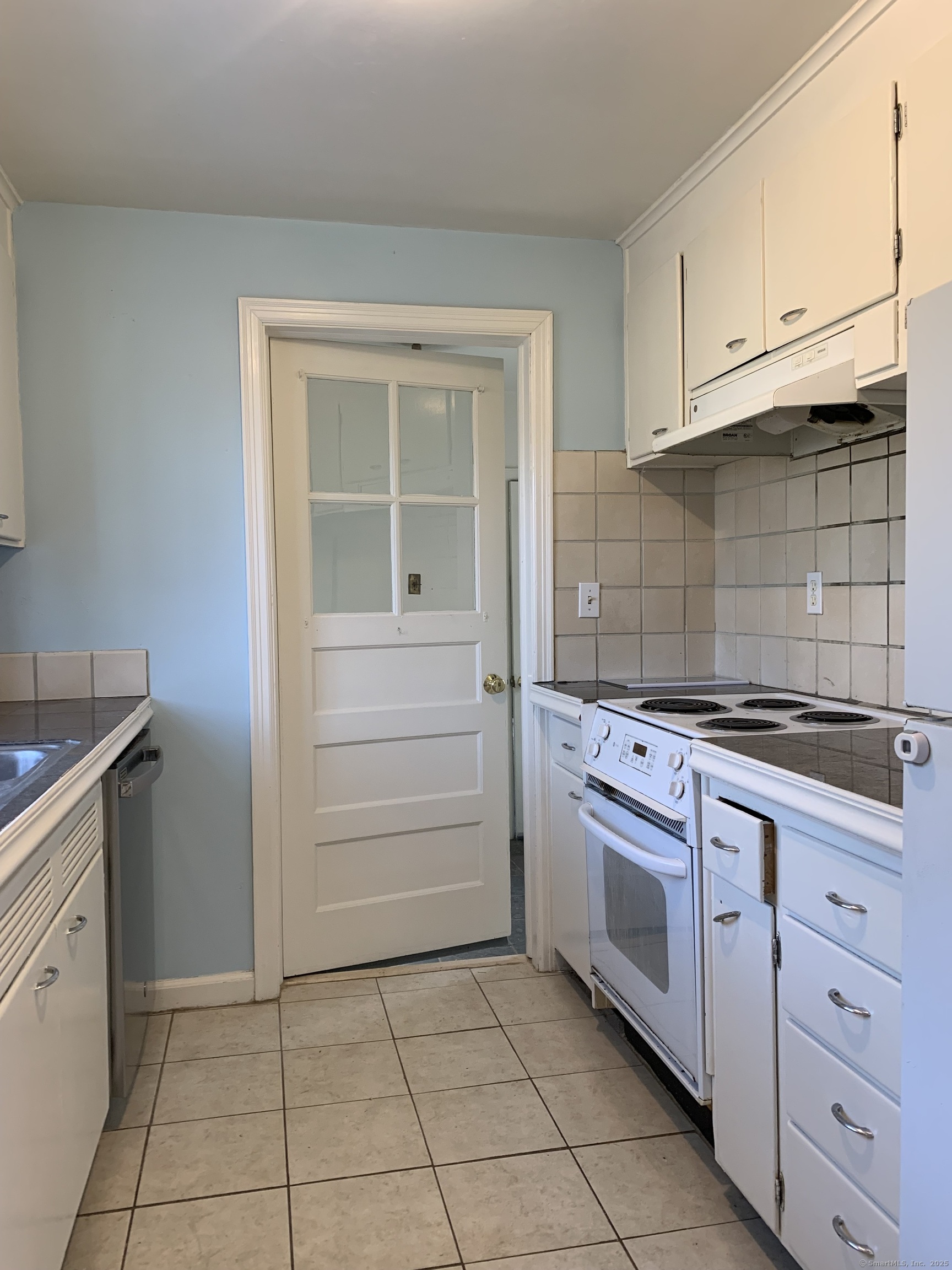 16 Garfield Avenue North Haven, CT 06473 - Photo 6 of 26 a kitchen with a stove and a sink