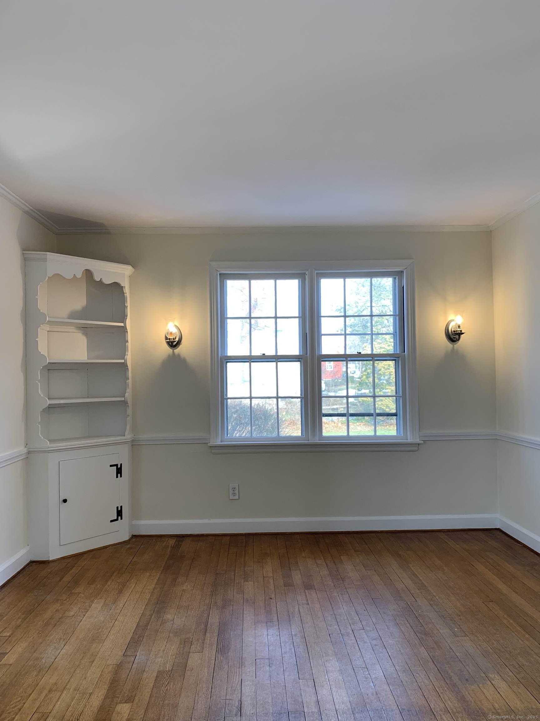 16 Garfield Avenue North Haven, CT 06473 - Photo 9 of 26 a view of a room with wooden floors and window