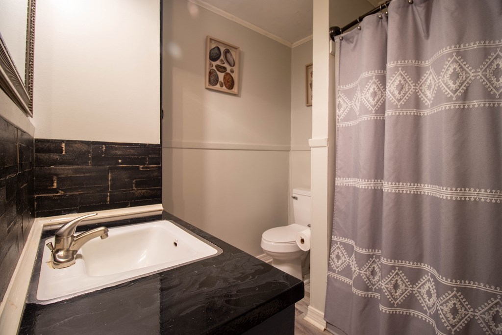 2811 16th Avenue Valley, AL 36854 - Photo 17 of 23 a bathroom with a sink toilet and shower