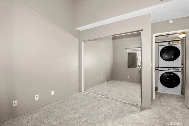 a view of a hallway with washer and dryer