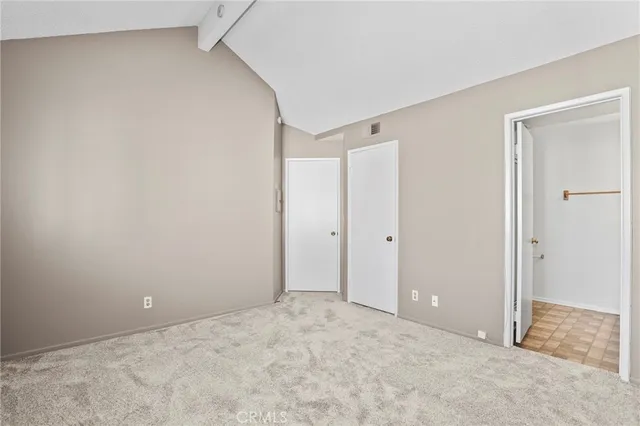 a view of a room with a fan and a window