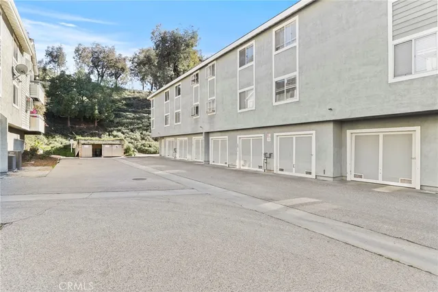 a view of an empty room and a fireplace