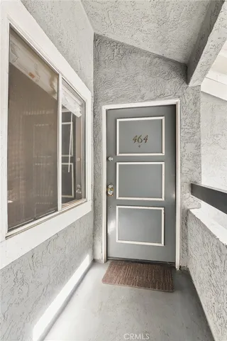 a picture of a bench in front of a wall