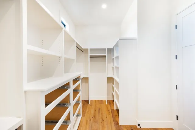 a view of an empty walk in closet