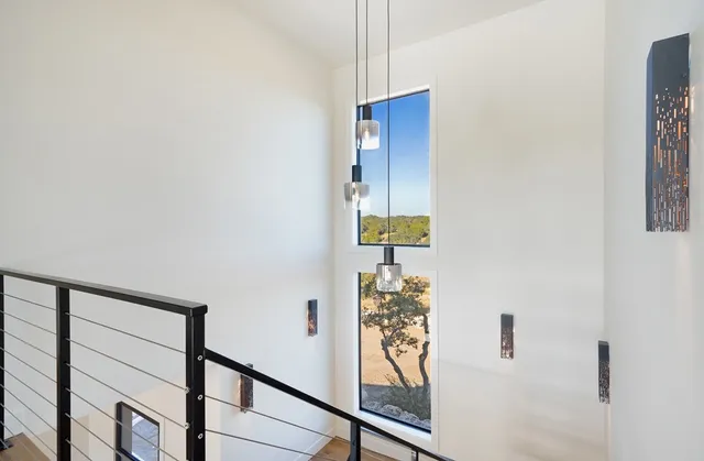 a bathroom with a glass shower door and mirror