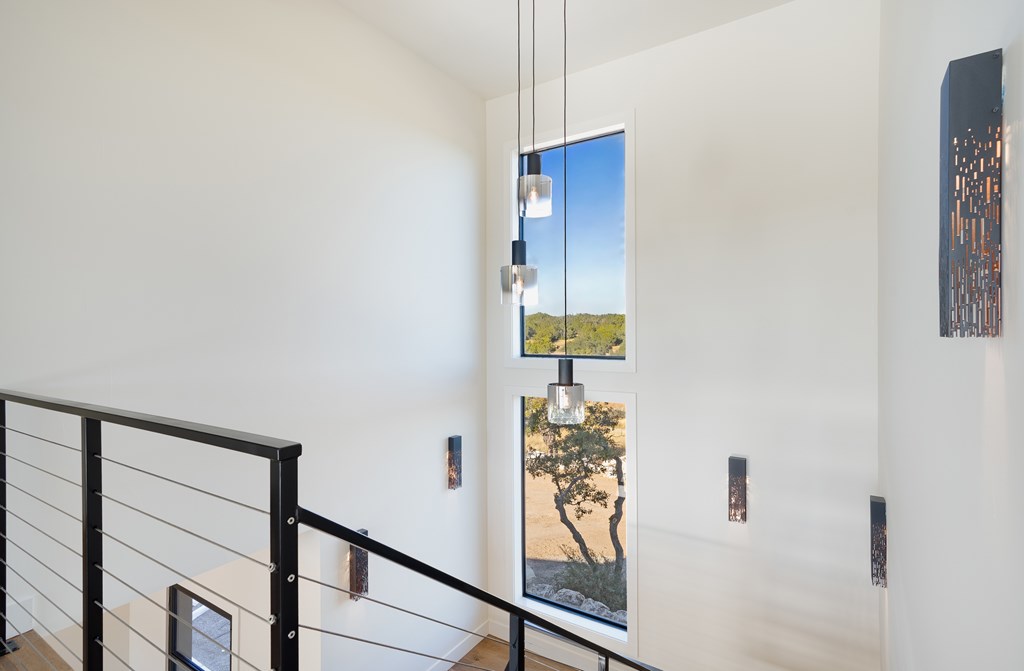 Lot 6 West W Highway, Unit 6 Hunt, TX 78024 - Photo 24 of 40 a view of a hallway with wooden floor and a potted plant