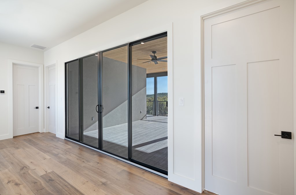Lot 6 West W Highway, Unit 6 Hunt, TX 78024 - Photo 25 of 40 a bathroom with a glass shower door and mirror