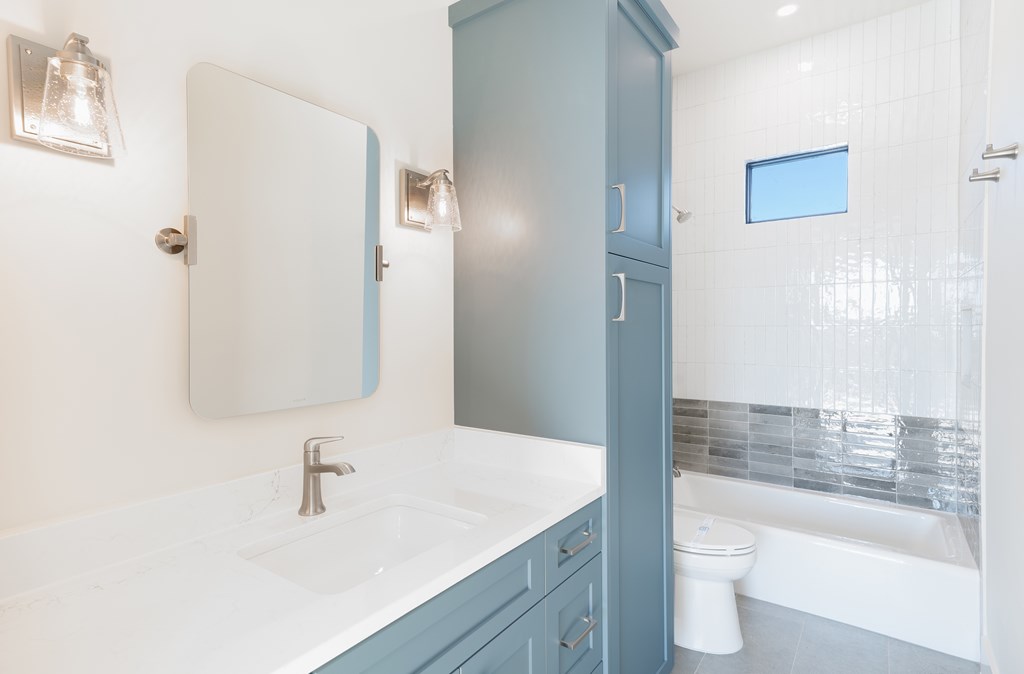 Lot 6 West W Highway, Unit 6 Hunt, TX 78024 - Photo 31 of 40 a bathroom with a granite countertop sink toilet and shower