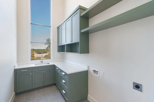 a bathroom with a tub sink and mirror