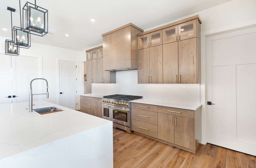 Lot 6 West W Highway, Unit 6 Hunt, TX 78024 - Photo 5 of 40 a kitchen with a stove a sink and a refrigerator
