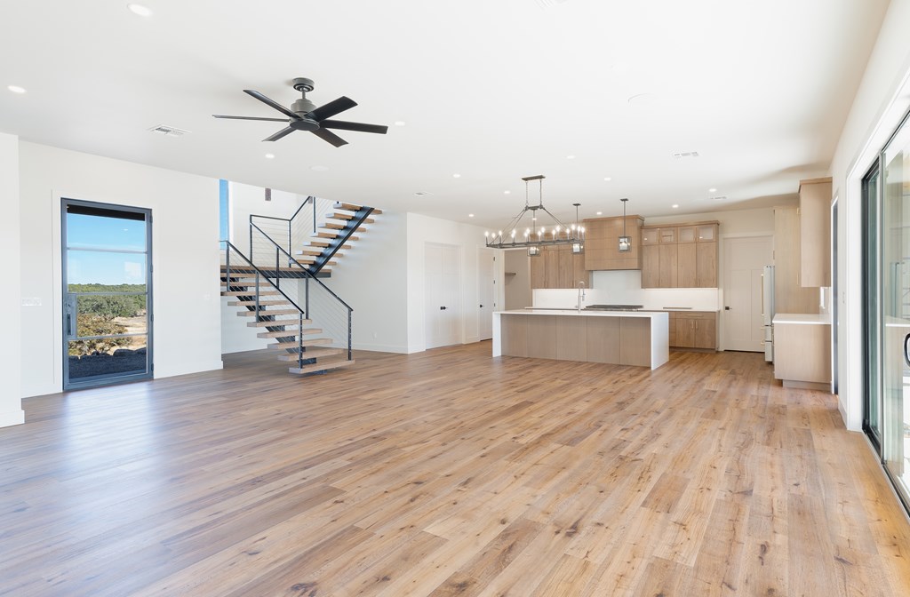 Lot 6 West W Highway, Unit 6 Hunt, TX 78024 - Photo 10 of 40 a view of a room with wooden floor and windows