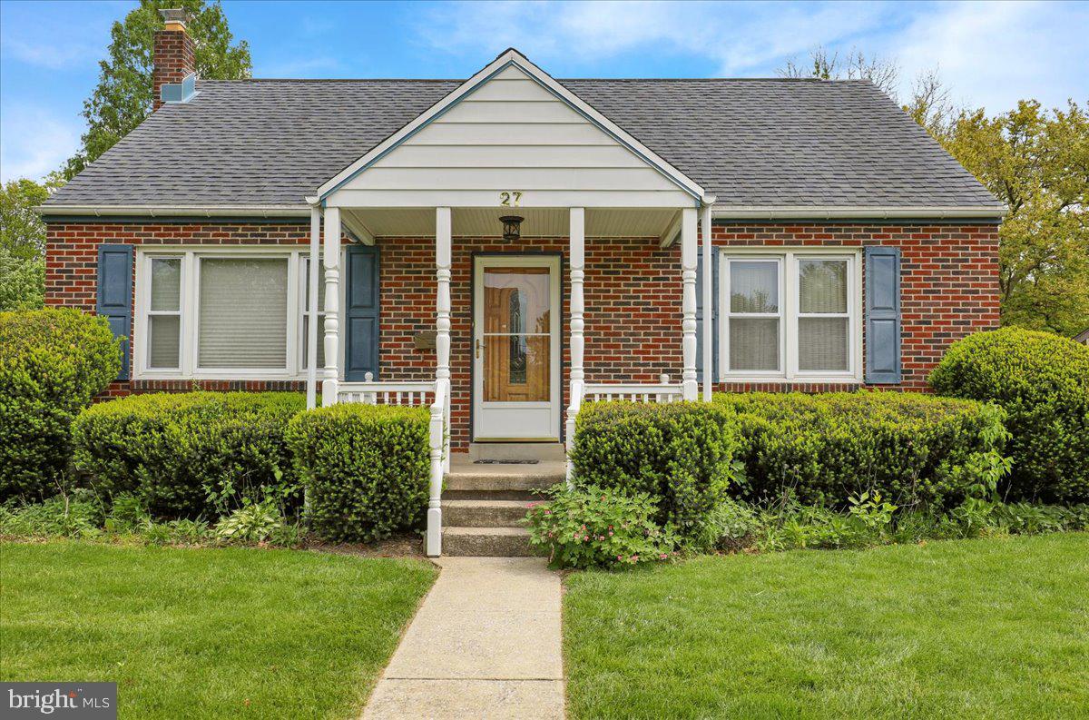 27 Woodland Road Reading, PA 19610 - Photo 2 of 34 a front view of a house with a yard
