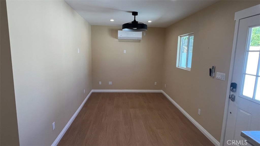 10908 Canby Avenue Porter Ranch, CA 91326 - Photo 14 of 26 wooden floor in an empty room with a window