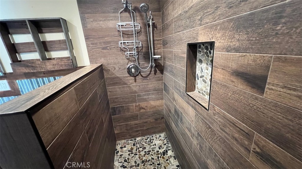 10908 Canby Avenue Porter Ranch, CA 91326 - Photo 23 of 26 a bathroom with a shower