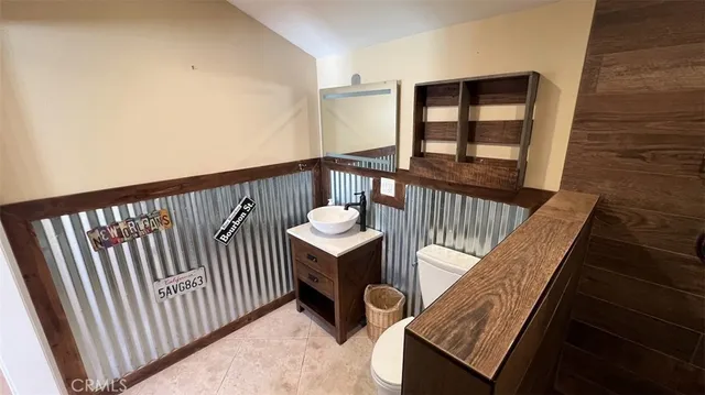 a white toilet sitting next to a window